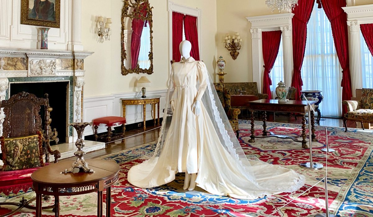 Huldah's wedding dress on display in the period drawing room at Cheekwood, 2022